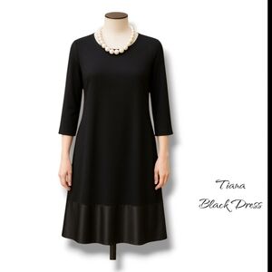 Elegant Black Dress with Pearl Necklace